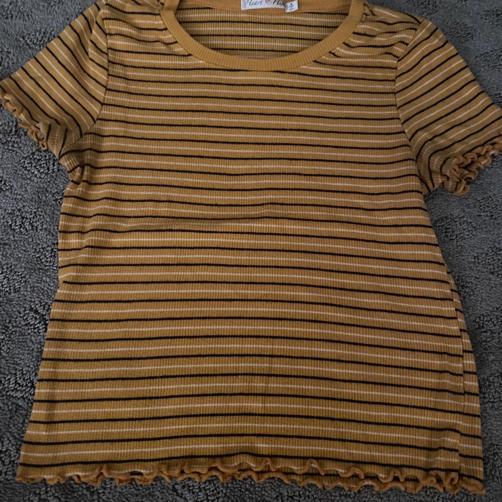 A mustard/black striped tee